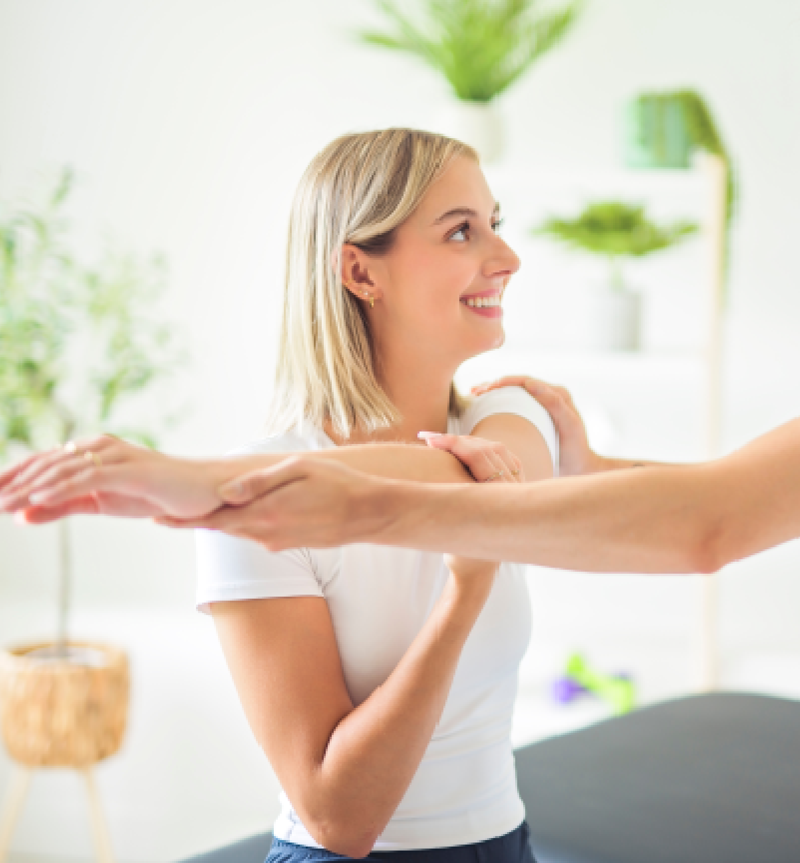 Physical therapist helping a patient with arm mobility